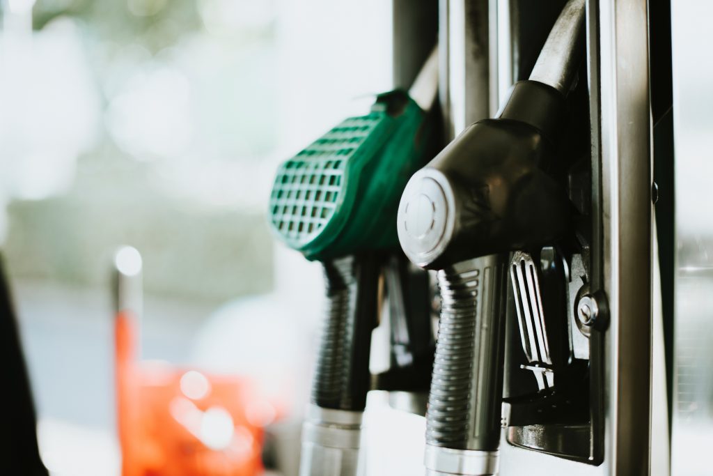 a fuel pump handle at a gas station